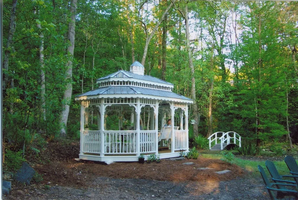 10x16 oval painted gazebo with double roof and glider in Columbus GA